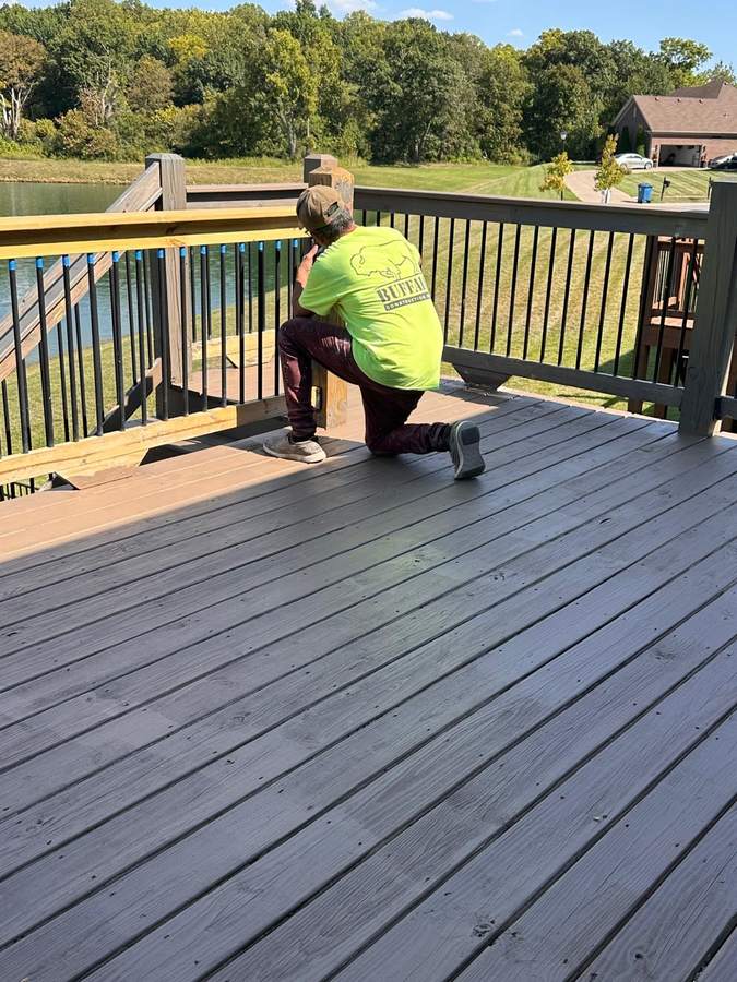 Daniel's Crew team member at work on a deck project